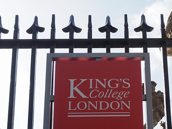 Red King's College London sign on railings